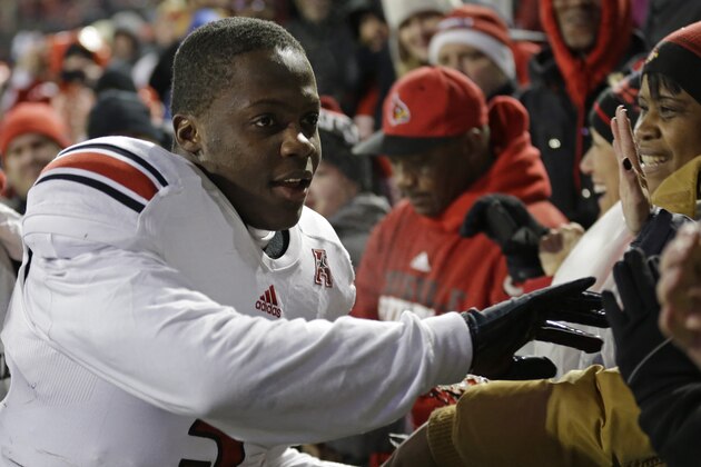 Louisville quarterback Teddy Bridgewater thanks the fans after defeating Cincinnati 31-24 in overtime in an NCAA college football game on Thursday, Dec. 5, 2013, in Cincinnati. (AP Photo/Al Behrman) Louisville quarterback Teddy Bridgewater thanks the fans after defeating Cincinnati 31-24 in overtime in an NCAA college football game on Thursday, Dec. 5, 2013, in Cincinnati. (AP Photo/Al Behrman)
