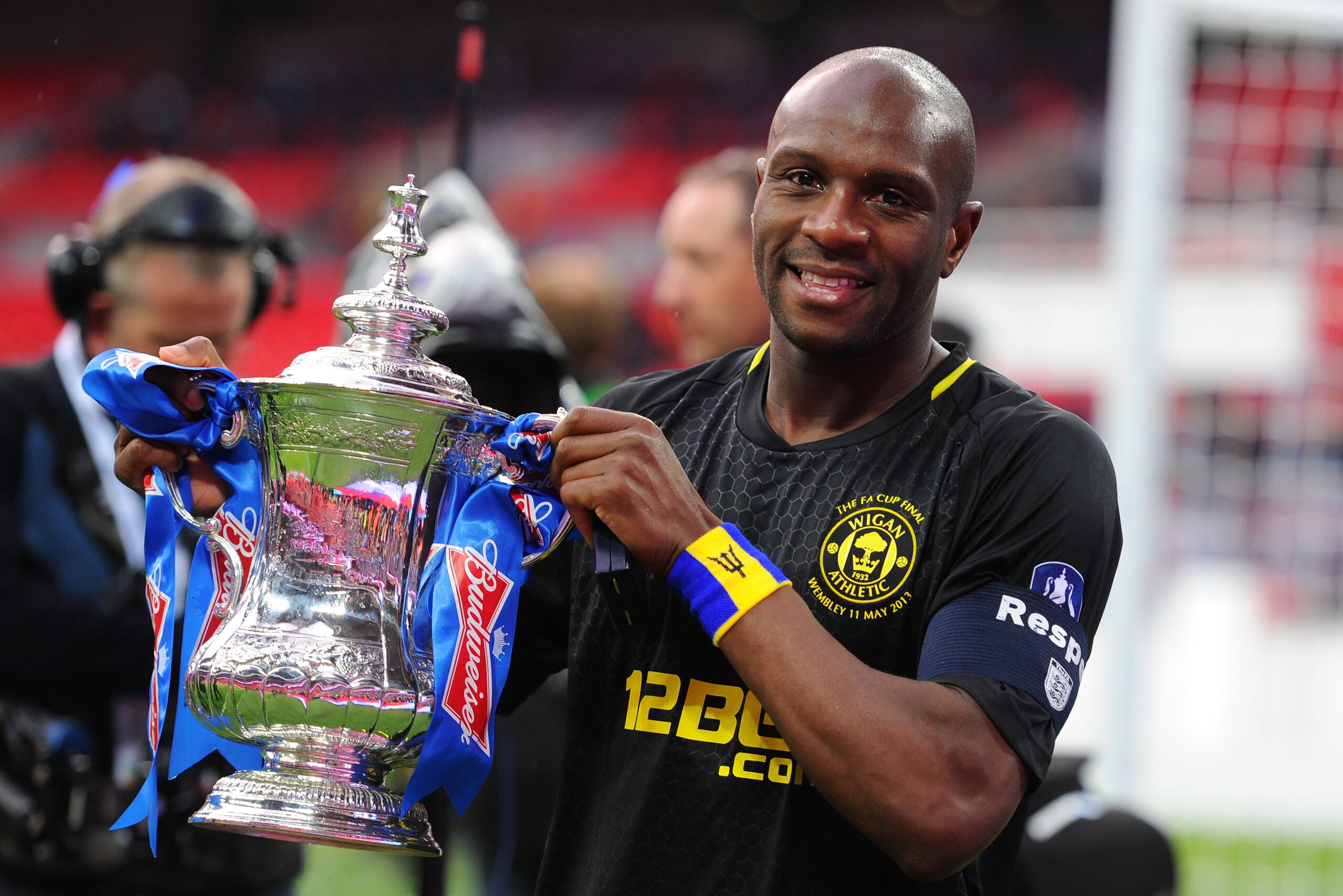 LONDON, ENGLAND - MAY 11:  Captain Emmerson Boyce of Wigan Athletic celebrates with the trophy following his team's 1-0 victory during the FA Cup with Budweiser Final between Manchester City and Wigan Athletic at Wembley Stadium on May 11, 2013 in London, England.  (Photo by Mike Hewitt/Getty Images)