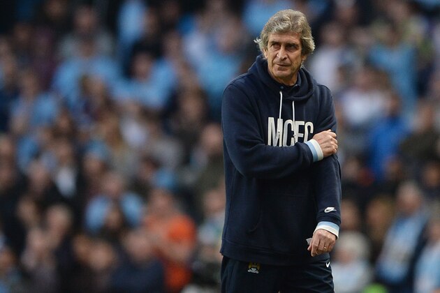 MANCHESTER, ENGLAND - MARCH 09:  Manchester City manager Manuel Pellegrini looks dejected during the FA Cup Quarter-Final match between Manchester City and Wigan Athletic at the Etihad Stadium on March 9, 2014 in Manchester, England.  (Photo by Michael Regan/Getty Images)