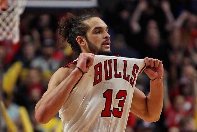 CHICAGO, IL - MARCH 09: Joakim Noah #13 of the Chicago Bulls pulls on his jersey in celebration at the end of a game against the Miami Heat at the United Center on March 9, 2014 in Chicago, Illinois. The Bulls defeated the Heat 95-88 in overtime. NOTE TO USER: User expressly acknowledges and agrees that, by downloading and or using this photograph, User is consenting to the terms and conditions of the Getty Images License Agreement. (Photo by Jonathan Daniel/Getty Images)