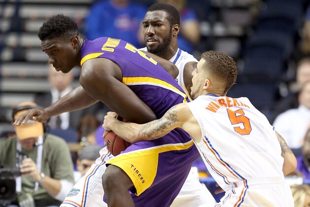 NASHVILLE, TN - MARCH 15:  Johnny O'Bryant III #2 of the LSU Tigers handles the ball as Scottie Wilbekin #5 of the Florida Gators reaches for it in the second half during the Quarterfinals of the SEC basketball tournament at Bridgestone Arena on March 15, 2013 in Nashville, Tennessee.  (Photo by Andy Lyons/Getty Images)