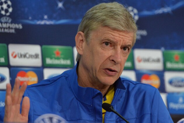 Arsenal's head coach Arsene Wenger speaks to media during a press conference in Munich, southern Germany, Monday, March 10, 2014, ahead of their round of 16 second leg Champions League soccer match against FC Bayern on Tuesday. (AP Photo/Kerstin Joensson)