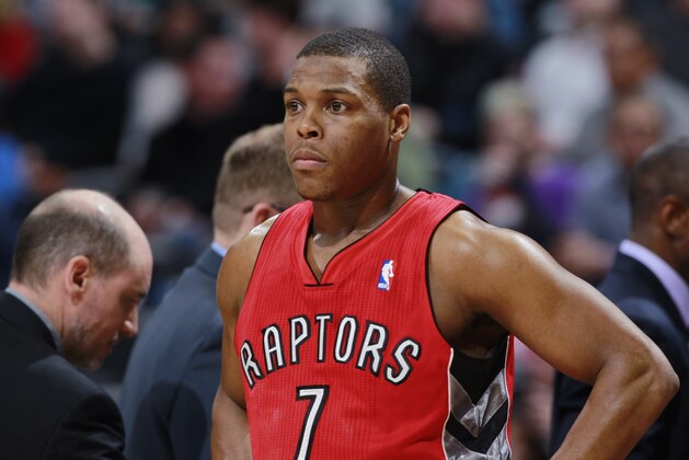 Toronto Raptors guard Kyle Lowry looks on against the Denver Nuggets in the third quarter of the Raptors' 100-90 victory in an NBA basketball game in Denver on Friday, Jan. 31, 2014. (AP Photo/David Zalubowski)