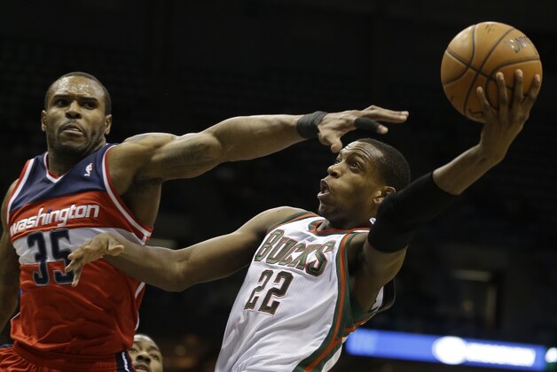 Milwaukee Bucks' Khris Middleton (22) drives against Washington Wizards' Trevor Booker during the second half of an NBA basketball game on Saturday, March 8, 2014, in Milwaukee. (AP Photo/Jeffrey Phelps) Milwaukee Bucks' Khris Middleton (22) drives against Washington Wizards' Trevor Booker during the second half of an NBA basketball game on Saturday, March 8, 2014, in Milwaukee. (AP Photo/Jeffrey Phelps)