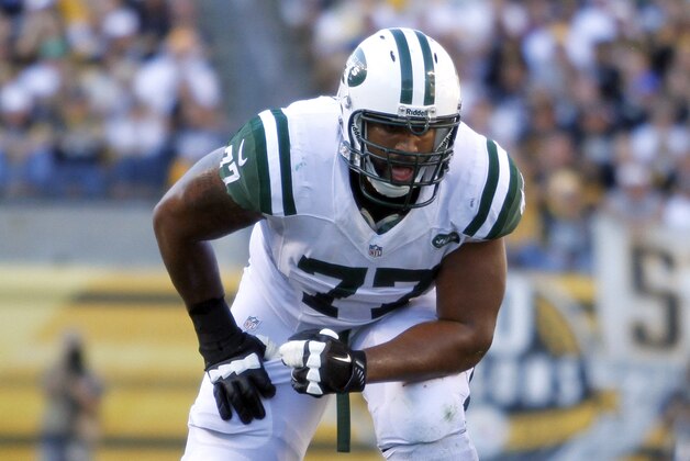 PITTSBURGH, PA - SEPTEMBER 16:  Austin Howard #77 of the New York Jets blocks against the Pittsburgh Steelers during the game on September 16, 2012 at Heinz Field in Pittsburgh, Pennsylvania.  (Photo by Justin K. Aller/Getty Images)