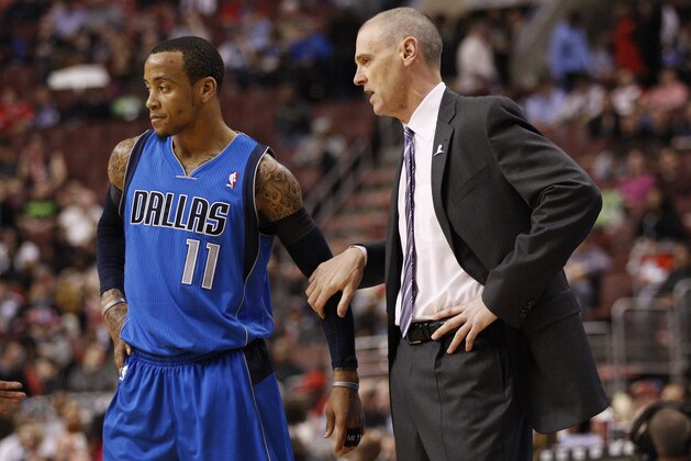 Dallas Mavericks' head coach Rick Carlisle, right, talks things over with Monta Ellis, left, during the first half of an NBA basketball game against the Philadelphia 76ers, Friday, Feb. 21, 2014, in Philadelphia. The Mavericks won 124-112. (AP Photo/Chris Szagola)