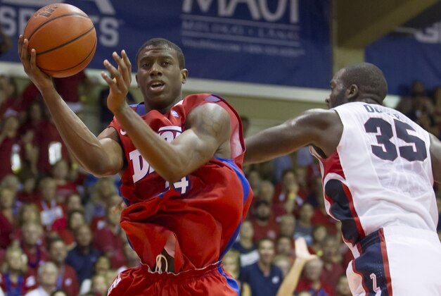 Dayton guard Jordan Sibert looks to pass off the basketball while being defended by Gonzaga center Sam Dower (35) in the second half of an NCAA college basketball game at the Maui Invitational on Monday, Nov. 25, 2013, in Lahaina, Hawaii. Dayton upset Gonzaga 84-79. (AP Photo/Eugene Tanner)