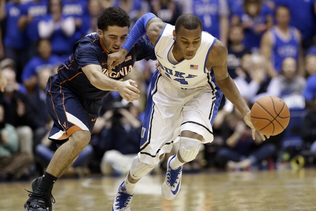 Duke's Rasheed Sulaimon, right, and Virginia's London Perrantes chase a loose ball during the first half of an NCAA college basketball game in Durham, N.C., Monday, Jan. 13, 2014. (AP Photo/Gerry Broome)