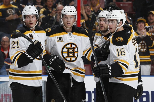SUNRISE, FL - MARCH 9: Carl Soderberg #34 of the Boston Bruins is congratulated by teammates including Loui Eriksson #21 and Reilly Smith #18 after scoring a second period goal against the Florida Panthers at the BB&T Center on March 9, 2014 in Sunrise, Florida. (Photo by Joel Auerbach/Getty Images)