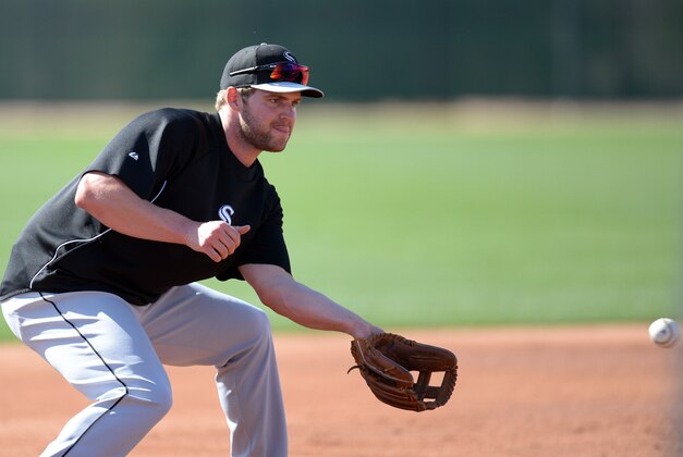 Feb 24, 2014; Glendale, AZ, USA; Chicago White Sox third baseman Matt Davidson (22) fields a ball during a workout at Camelback Ranch. Mandatory Credit: Joe Camporeale-USA TODAY Sports