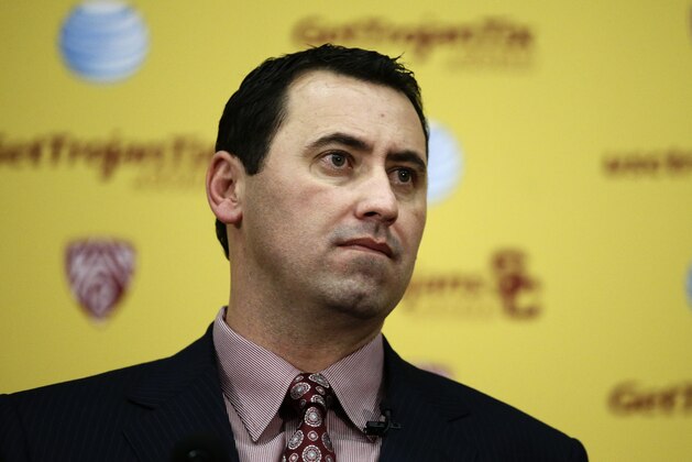 New Southern California football head coach Steve Sarkisian looks on during a news conference on Tuesday, Dec. 3, 2013, in Los Angeles. USC hired Sarkisian away from Washington on Monday, bringing back the former Trojans offensive coordinator to his native Los Angeles area and the storied program where he thrived as Pete Carroll's assistant. (AP Photo/Jae C. Hong)
