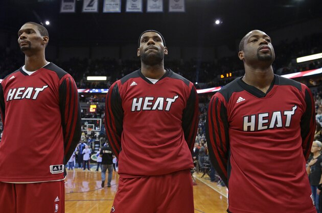 MINNEAPOLIS, MN - DECEMBER 7:  Chris Bosh #1, LeBron James #6 and Dwyane Wade #3 of the Miami Heat stand on the court against the Minnesota Timberwolves on December 7, 2013 at Target Center in Minneapolis, Minnesota. NOTE TO USER: User expressly acknowledges and agrees that, by downloading and or using this Photograph, user is consenting to the terms and conditions of the Getty Images License Agreement. Mandatory Copyright Notice: Copyright 2013 NBAE (Photo by Jordan Johnson/NBAE via Getty Images)