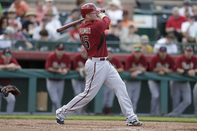 Arizona Diamondbacks' Mark Trumbo hits a double while batting against the San Francisco Giants during the fifth inning of a spring training baseball game Sunday, March 2, 2014, in Scottsdale, Ariz. (AP Photo/Gregory Bull)