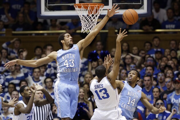 Duke's Matt Jones (13) shoots as North Carolina's James Michael McAdoo (43) and Desmond Hubert (14) defend during the first half of an NCAA college basketball game in Durham, N.C., Saturday, March 8, 2014. (AP Photo/Gerry Broome) Duke's Matt Jones (13) shoots as North Carolina's James Michael McAdoo (43) and Desmond Hubert (14) defend during the first half of an NCAA college basketball game in Durham, N.C., Saturday, March 8, 2014. (AP Photo/Gerry Broome)