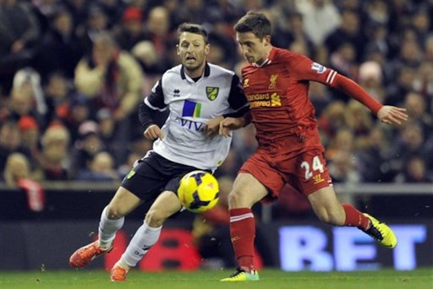 Liverpool's Joe Allen, right, and Norwich City's Wesley Hoolahan battle for the ball during their English Premier League soccer match at Anfield in Liverpool, England, Wednesday Dec. 4, 2013. (AP Photo/Clint Hughes) Liverpool's Joe Allen, right, and Norwich City's Wesley Hoolahan battle for the ball during their English Premier League soccer match at Anfield in Liverpool, England, Wednesday Dec. 4, 2013. (AP Photo/Clint Hughes)