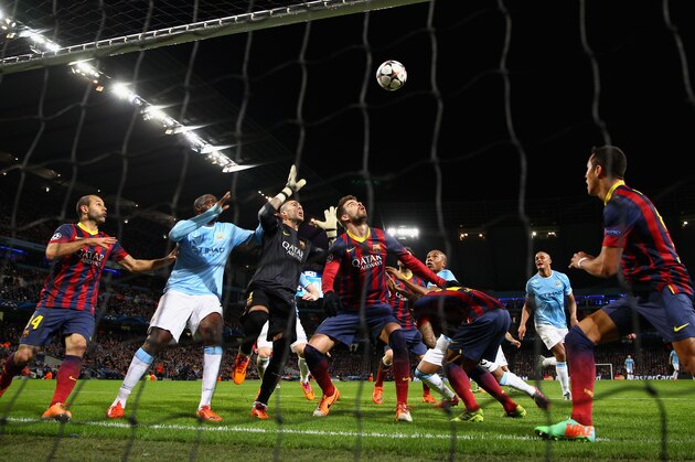 MANCHESTER, ENGLAND - FEBRUARY 18:  Victor Valdes of Barcelona rises to make a save under pressure during the UEFA Champions League Round of 16 first leg match between Manchester City and Barcelona at the Etihad Stadium on February 18, 2014 in Manchester, England.  (Photo by Clive Brunskill/Getty Images)