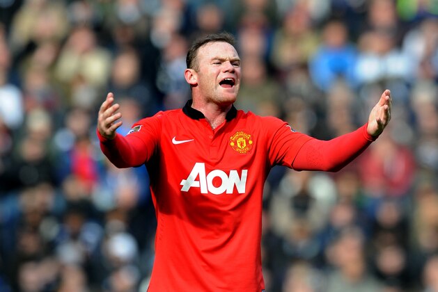Manchester United's Wayne Rooney shouts instructions to team mates during the English Premier League soccer match between West Bromwich Albion and Manchester United at The Hawthorns Stadium in West Bromwich, England, Saturday, March 8, 2014.  (AP Photo/Rui Vieira)