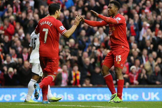 LIVERPOOL, ENGLAND - FEBRUARY 23:  Daniel Sturridge of Liverpool celebrates scoring his team's third goal with Luis Suarez during the Barclays Premier League match between Liverpool and Swansea City at Anfield on February 23, 2014 in Liverpool, England.  (Photo by Clive Brunskill/Getty Images)