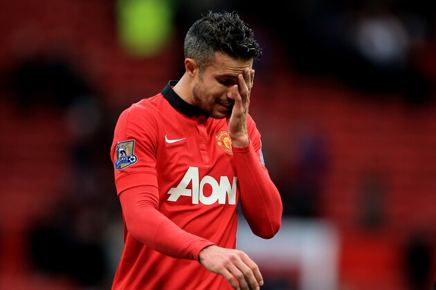 MANCHESTER, ENGLAND - DECEMBER 07:  A dejected Robin van Persie of Manchester United walks off the pitch following his team's 1-0 defeat during the Barclays Premier League match between Manchester United and Newcastle United at Old Trafford on December 7, 2013 in Manchester, England.  (Photo by Richard Heathcote/Getty Images)