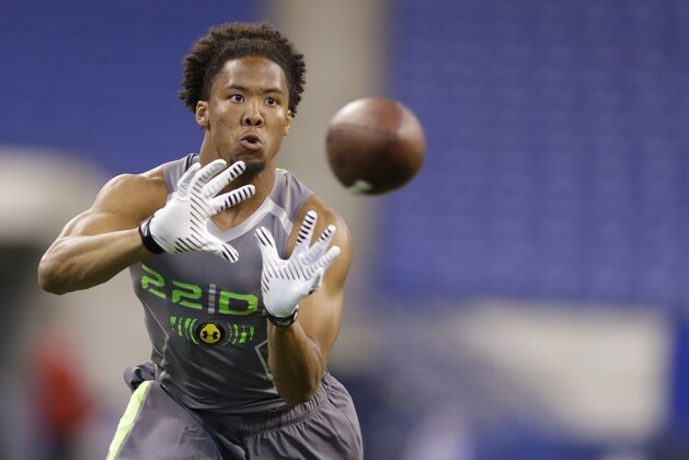 Virginia Tech defensive back Kyle Fuller runs a drill at the NFL football scouting combine in Indianapolis, Tuesday, Feb. 25, 2014. (AP Photo/Michael Conroy)