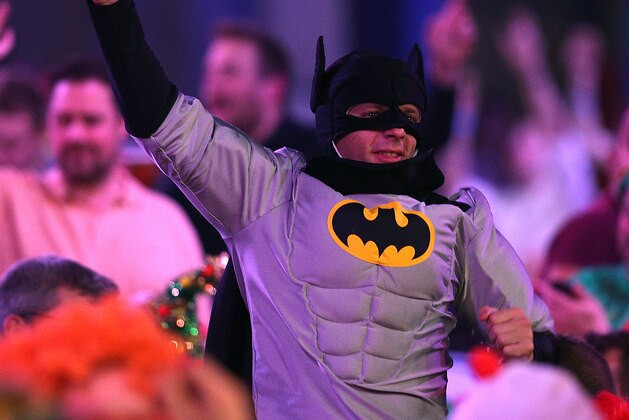 LONDON, ENGLAND - DECEMBER 21: A fan dressed as batman enjoys the darts during the Ladbrokes.com World Darts Championship on Day Nine at Alexandra Palace on December 21, 2013 in London, England. (Photo by Charlie Crowhurst/Getty Images)
