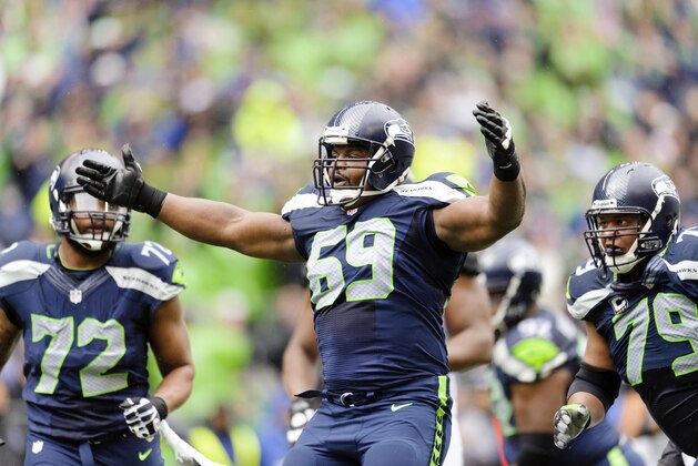 Sep 22, 2013; Seattle, WA, USA; Seattle Seahawks defensive tackle Clinton McDonald (69) celebrates after sacking Jacksonville Jaguars quarterback Chad Henne (7) during the 1st half at CenturyLink Field. Mandatory Credit: Steven Bisig-USA TODAY Sports