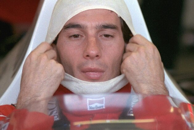 FILE -- Brazilian driver Ayrton Senna, adjusts his fireproof covering while sitting in his McLaren Honda before a practice session at the Australian Grand Prix in this Nov. 4, 1989 file photo. Nearly three years after Senna was killed in a crash at the San Marino Grand Prix in Italy, six Formula One officials face trial on manslaughter charges Thursday in a case that could threaten the future of the sport. (AP Photo) FILE -- Brazilian driver Ayrton Senna, adjusts his fireproof covering while sitting in his McLaren Honda before a practice session at the Australian Grand Prix in this Nov. 4, 1989 file photo. Nearly three years after Senna was killed in a crash at the San Marino Grand Prix in Italy, six Formula One officials face trial on manslaughter charges Thursday in a case that could threaten the future of the sport. (AP Photo)