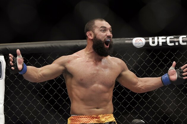 Johny Hendricks reacts following a UFC 167 mixed martial arts championship welterweight bout against Georges St. Pierre, of Canada, on Saturday, Nov. 16, 2013, in Las Vegas. St. Pierre won by split decision. (AP Photo/Isaac Brekken)