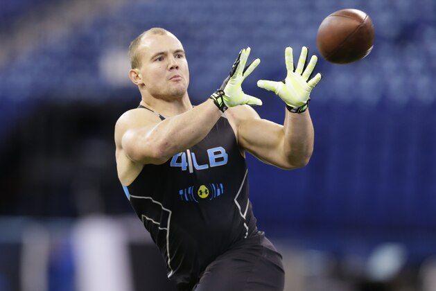 Wisconsin linebacker Chris Borland runs a drill at the NFL football scouting combine in Indianapolis, Monday, Feb. 24, 2014. (AP Photo/Michael Conroy)
