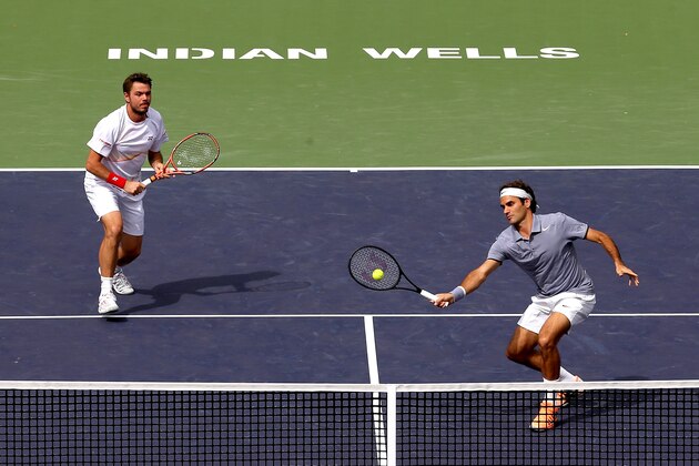INDIAN WELLS, CA - MARCH 07:  Roger Federer and Stanislas Wawrinka of Switzerland play Rohan Bopanna of India and Aisam-Ul-Haqureshi of Pakistan during the BNP Parabas Open at the Indian Wells Tennis Garden on March 7, 2014 in Indian Wells, California.  (Photo by Matthew Stockman/Getty Images)