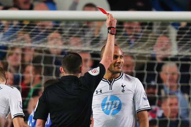 LONDON, ENGLAND - MARCH 08:  Younes Kaboul of Spurs is shown the red card by Referee Michael Oliver after bringing down Samuel Eto'o of Chelsea in the penalty area during the Barclays Premier League match between Chelsea and Tottenham Hotspur at Stamford Bridge on March 8, 2014 in London, England.  (Photo by Clive Rose/Getty Images)