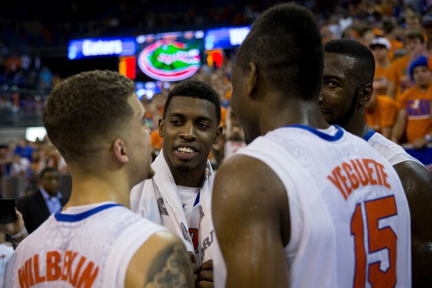 GAINESVILLE, FL - MARCH 08: Casey Prather #24, Patric Young #4, Scottie Wilbekin #5 and Will Yeguete #15 of the Florida Gators gather on the court after the game against the Kentucky Wildcats at the Stephen C. O'Connell Center on March 8, 2014 in Gainesville, Florida. (Photo by Rob Foldy/Getty Images)