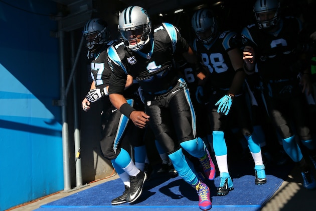 CHARLOTTE, NC - JANUARY 12: Cam Newton #1 of the Carolina Panthers leads the team out of the tunnel prior to the NFC Divisional Playoff Game against the San Francisco 49ers at Bank of America Stadium on January 12, 2014 in Charlotte, North Carolina. (Photo by Ronald Martinez/Getty Images) CHARLOTTE, NC - JANUARY 12: Cam Newton #1 of the Carolina Panthers leads the team out of the tunnel prior to the NFC Divisional Playoff Game against the San Francisco 49ers at Bank of America Stadium on January 12, 2014 in Charlotte, North Carolina. (Photo by Ronald Martinez/Getty Images)