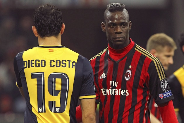 MILAN, ITALY - FEBRUARY 19:  Mario Balotelli (R) of AC Milan and Diego Costa of Club Atletico de Madrid look on during the UEFA Champions League Round of 16 match between AC Milan and Club Atletico de Madrid at Stadio Giuseppe Meazza on February 19, 2014 in Milan, Italy.  (Photo by Marco Luzzani/Getty Images)