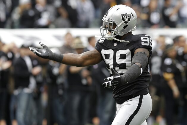 Oakland Raiders defensive end Lamarr Houston (99) before an NFL football game against the Pittsburgh Steelers in Oakland, Calif., Sunday, Oct. 27, 2013. (AP Photo/Ben Margot)