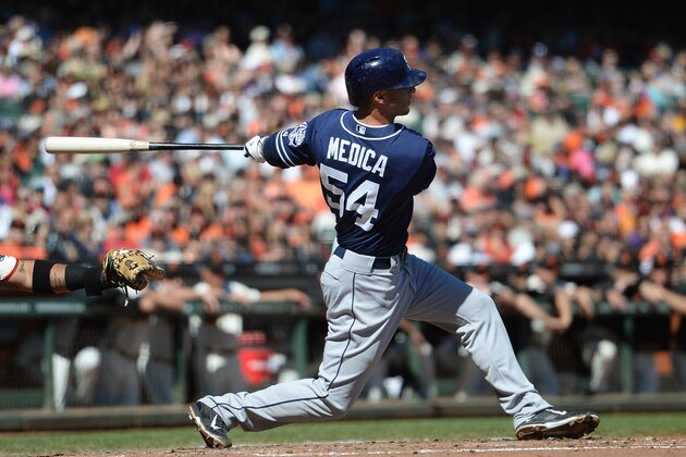 SAN FRANCISCO, CA - SEPTEMBER 28:  Tommy Medica #54 of the San Diego Padres hits an RBI single scoring Chase Headley #7 (not pictured) during the fourth inning against the San Francisco Giants at AT&T Park on September 28, 2013 in San Francisco, California.  (Photo by Thearon W. Henderson/Getty Images)