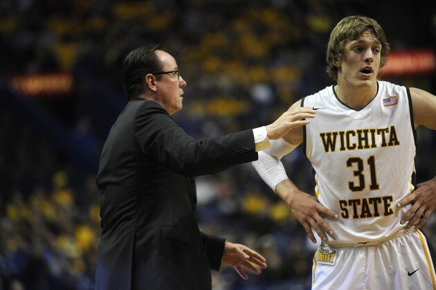 Wichita State coach Gregg Marshall directs Ron Baker (31) against Indiana State in an NCAA college basketball game in the championship of the Missouri Valley Conference men's tournament, Sunday, March 9, 2014, in St. Louis. (AP Photo/Bill Boyce)