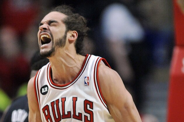 Chicago Bulls Joakim Noah reacts after being fouled by Miami Heat's Greg Oden during the first half of an NBA basketball game in Chicago, Sunday, March 9, 2014. (AP Photo/ Paul Beaty)
