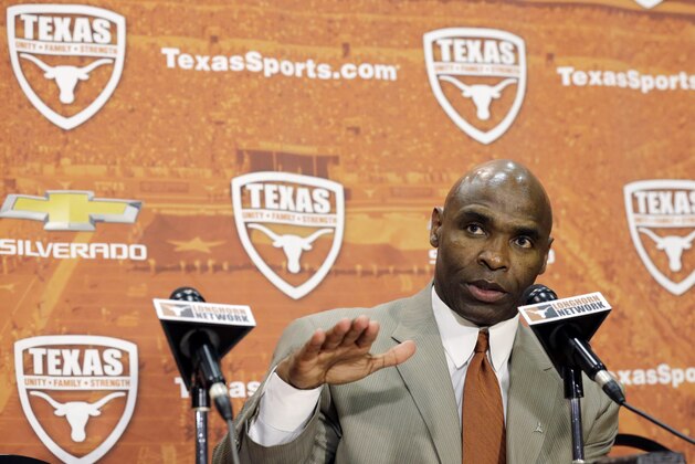 Charlie Strong answers questions during an NCAA college football news conference where Strong was introduced as the new Texas football coach, Monday, Jan. 6, 2014, in Austin, Texas. Strong replaces Mack Brown, who coached Texas for 16 years and won the 2005 national championship.