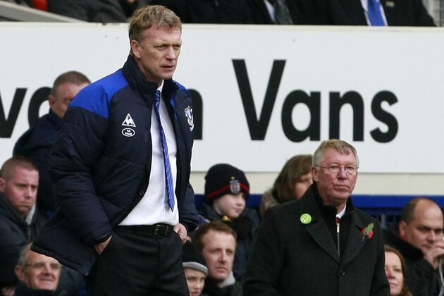 Manchester United manager Alex Ferguson, right, and Everton manager David Moyes watch on during their English Premier League soccer match at Goodison Park, Liverpool, England, Saturday Oct. 29, 2011. (AP Photo/Tim Hales)