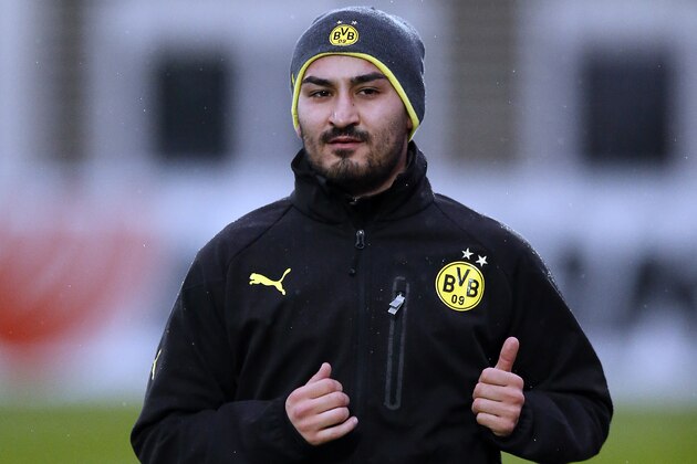 Dortmund's Ilkay Gundogan warms up during a training session one day ahead the Champions League group F soccer match between Borussia Dortmund and Arsenal FC in Dortmund, Germany, Tuesday, Nov. 5, 2013. (AP Photo/Frank Augstein)