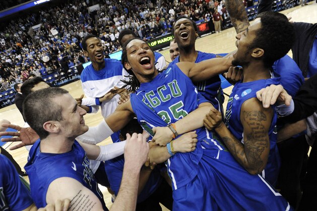 FILE - In this March 24, 2013, file photo, Florida Gulf Coast's Sherwood Brown, center, celebrates with teammates after their 81-71 win over San Diego State in a third-round game in the NCAA college basketball tournament in Philadelphia. Florida Gulf Coast became the first No. 15 seed to make the Sweet 16. (AP Photo/Michael Perez, File)