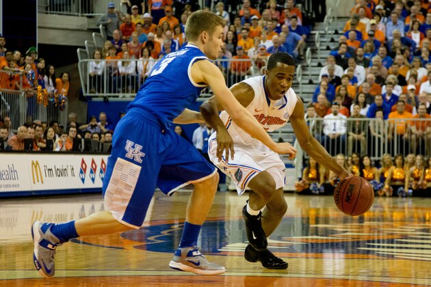 GAINESVILLE, FL - MARCH 08: Kasey Hill #0 of the Florida Gators is defended by Jarrod Polson #3 of the Kentucky Wildcats during the first half of the game at the Stephen C. O'Connell Center on March 8, 2014 in Gainesville, Florida. (Photo by Rob Foldy/Getty Images)