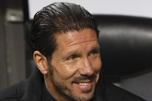 MILAN, ITALY - FEBRUARY 19:  Club Atletico de Madrid coach Diego Simeone looks on before the UEFA Champions League Round of 16 match between AC Milan and Club Atletico de Madrid at Stadio Giuseppe Meazza on February 19, 2014 in Milan, Italy.  (Photo by Marco Luzzani/Getty Images)