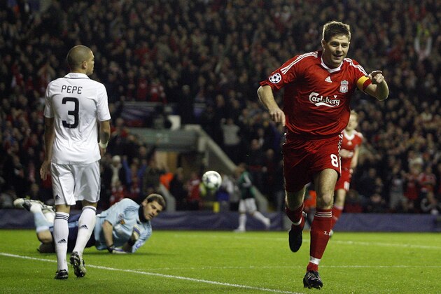 Liverpool's Steven Gerrard, right, reacts after scoring his second goal during their Champions League second round, second leg, soccer match against Real Madrid at Anfield Stadium, Liverpool, England, Tuesday, March 10, 2009. (AP Photo/Paul Thomas)