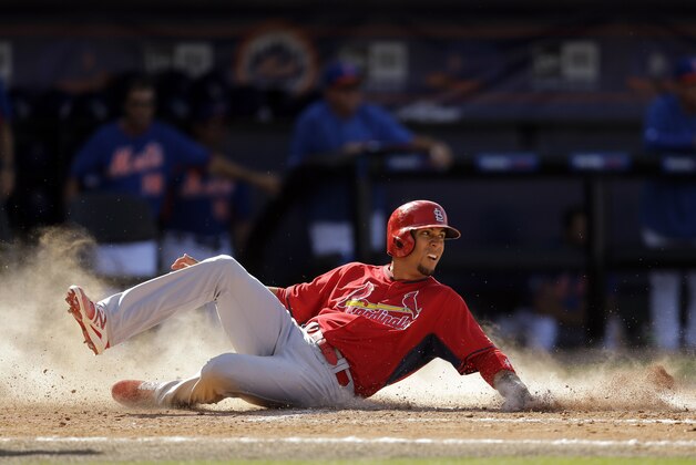 St. Louis Cardinals' Rafael Ortega scores on a single by Kolten Wong during the sixth inning of an exhibition spring training baseball game against the St. Louis Cardinals Friday, March 7, 2014, in Port St. Lucie, Fla. (AP Photo/Jeff Roberson)