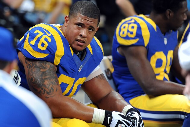 St. Louis Rams offensive tackle Rodger Saffold sits on the bench during the third quarter of an NFL football game against the Tampa Bay Buccaneers Sunday, Dec. 22, 2013, in St. Louis. (AP Photo/L.G. Patterson)