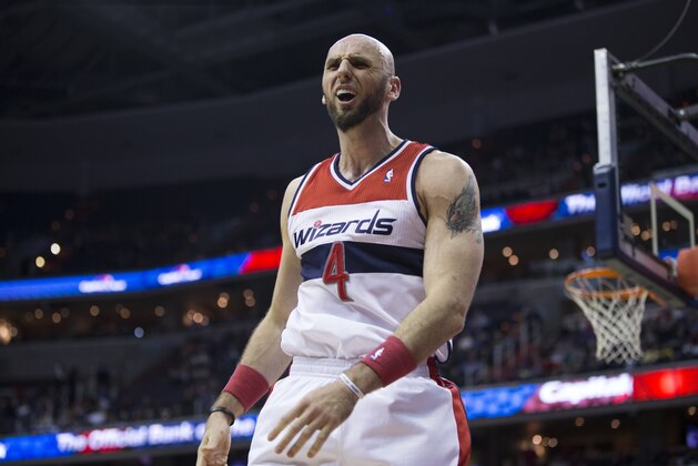 Washington Wizards center Marcin Gortat (4) argues a call during the second half of an NBA basketball game against the Utah Jazz on Wednesday, March 5, 2014, in Washington. (AP Photo/ Evan Vucci)