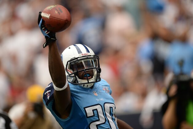 Sep 15, 2013; Houston, TX, USA; Tennessee Titans cornerback Alterraun Verner (20) celebrates returning an interception for a touchdown against the Houston Texans during the second half at Reliant Stadium. The Texans won 30-24. Mandatory Credit: Thomas Campbell-USA TODAY Sports