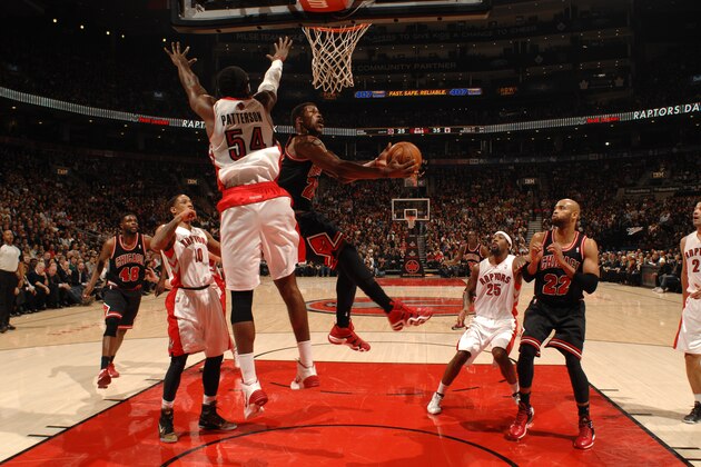 TORONTO, CANADA - February 19: Jimmy Butler #21 of the Chicago Bulls goes up for a shot during a game against the Toronto Raptors on February 19, 2014 at the Air Canada Centre in Toronto, Ontario, Canada.  NOTE TO USER: User expressly acknowledges and agrees that, by downloading and or using this Photograph, user is consenting to the terms and conditions of the Getty Images License Agreement.  Mandatory Copyright Notice: Copyright 2014 NBAE (Photo by Ron Turenne/NBAE via Getty Images)